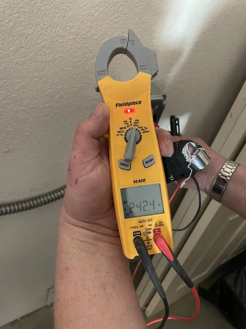 Voltage testing with clamp meter during Generator Installation in Lighthouse Point